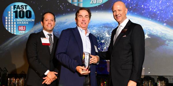 On-Demand-President-Michael-Gray-receiving-the-Houston-Business-Journal-Fast-100-Award