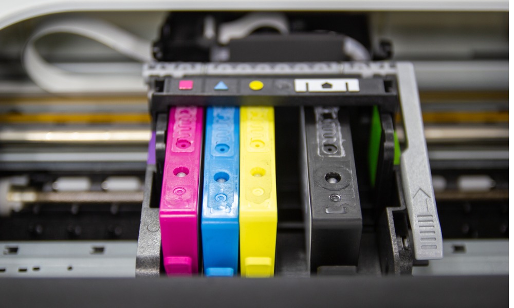 Printer-cartridges-being-replaced-which-is-an-office-equipment-best-practice